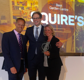 Andy Blunt (left) and Karen Smith (right) from Squire’s receive the award from Mark Dolan