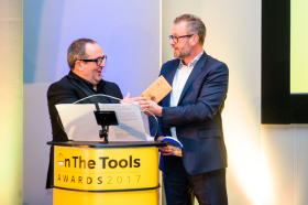 L-R: Host Justin Moorhouse presents Axminster Tools & Machinery brands director Martin Brown with the award on the night