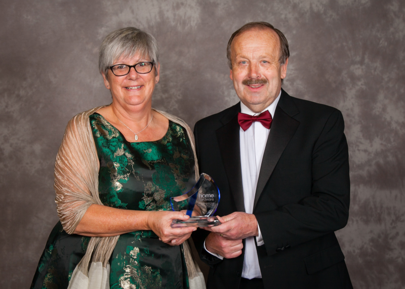 Fiona Robson being presented with her award by Home Hardware chairman David Adams