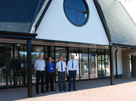 Bruce Robertson with Trago team members outside the new store