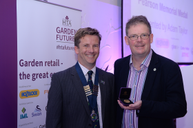 Adam Taylor presenting the pearson medal to Boyd Douglas-Davies