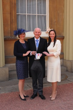 Colin Squire with his daughters Sarah and Elizabeth at Buckingham Palace