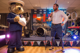 Help for Heroes mascot with Paralympian long jumper and former Royal Engineer Luke Sinnott address guests at the Polypipe Regatta celebration evening. Photo credit: Sarah Bardsley Photography
